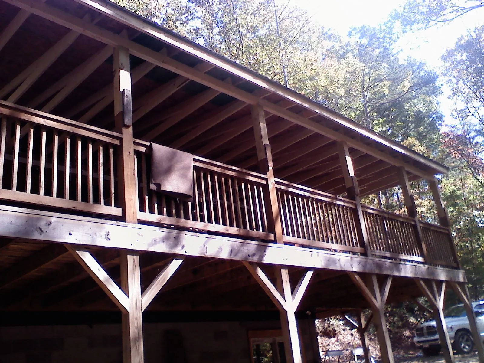 Timber framing under a new elevated porch and deck in West Liberty
